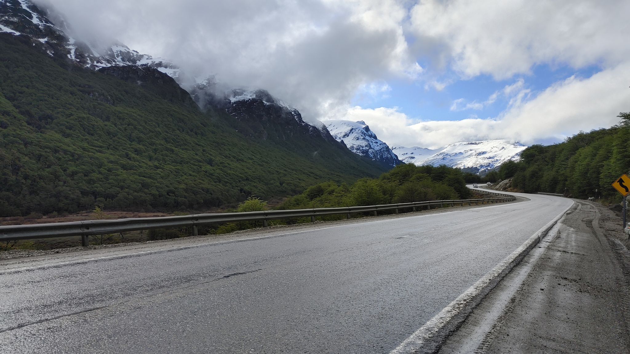 Scenic mountain road with snow-capped peaks