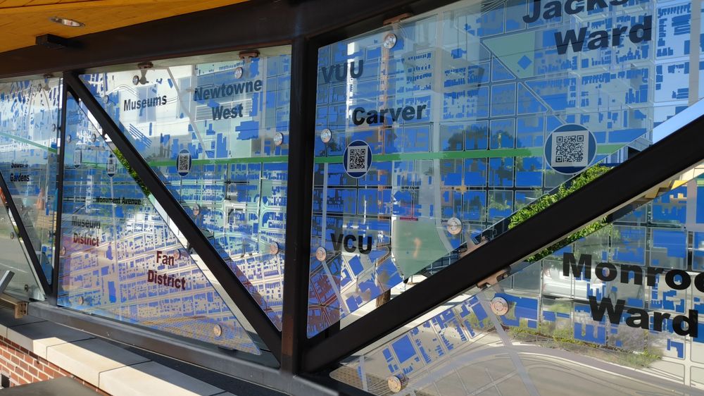 glass panels with imprinted map of the bus route and neighborhoods