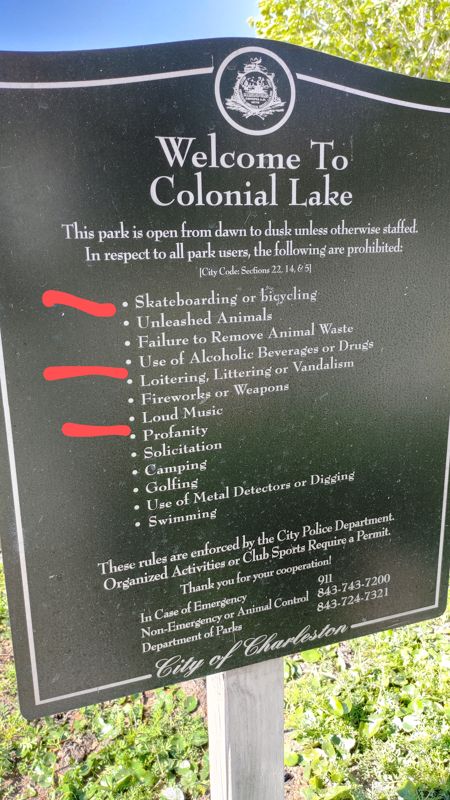 A sign at a park saying:
Welcome To Colonial Lake
This park is open from dawn to dusk unless otherwise staffed.
In respect to all park users, the following are prohibited:
City Code Sections 22, 14, 8 51
• Skateboarding or bicycing
Unleashed Animals
• Failure to Remove Animal Waste
• Use of Alcoholic Beverages or Drugs
• Loitering, Littering or Vandalism
• Fireworks or Weapons
• Loud Music
• Profanity
• Solicitation
• Camping
• Golfing
• Use of Metal Detectors or Digging
• Swimming
These rules are enforced by the City Police Department Organized Activities or Club, Spotts Require a Permit.
Thank you for your cooperation!